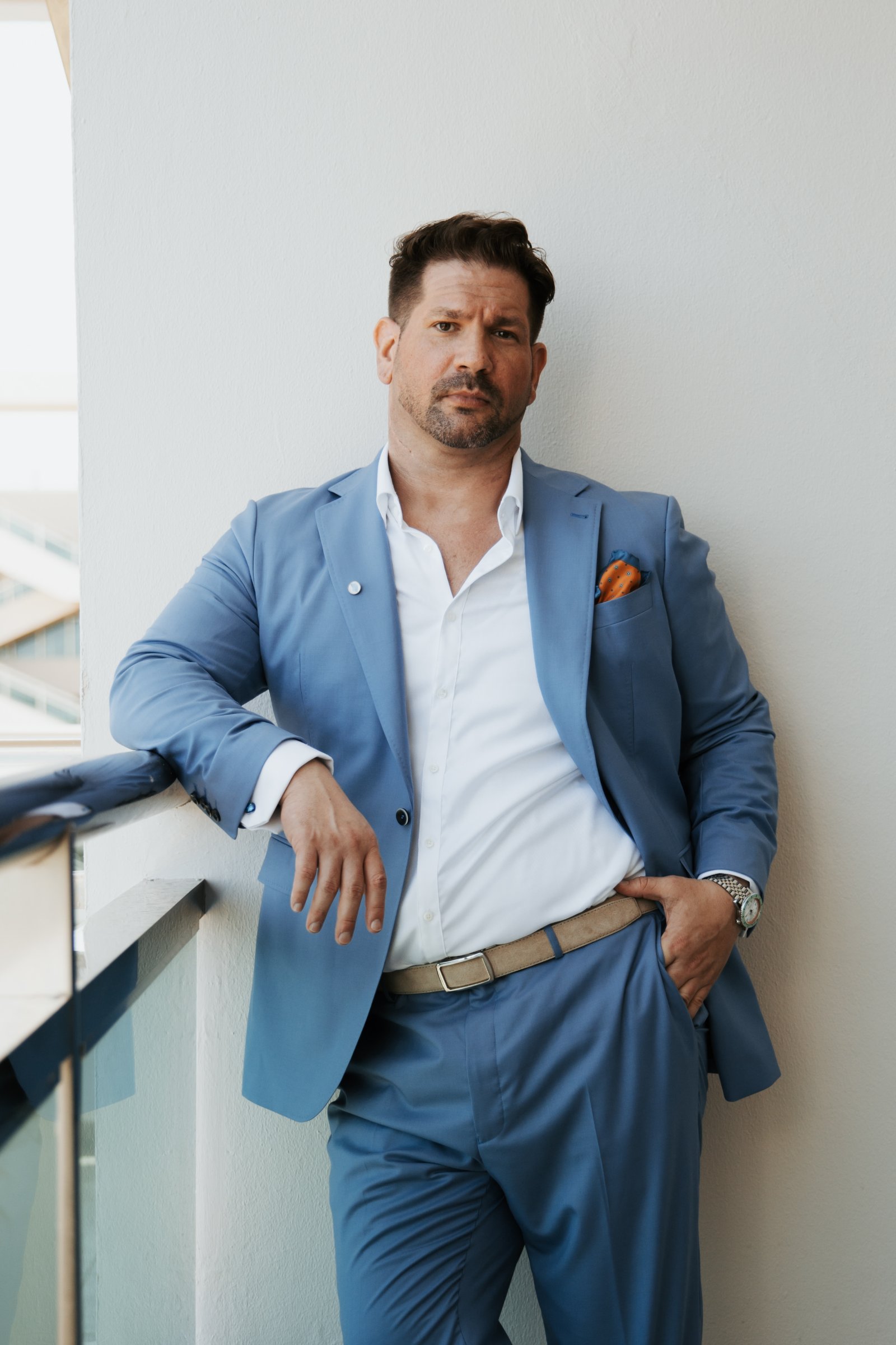 Portrait of Itay Bengal in a tailored blue suit